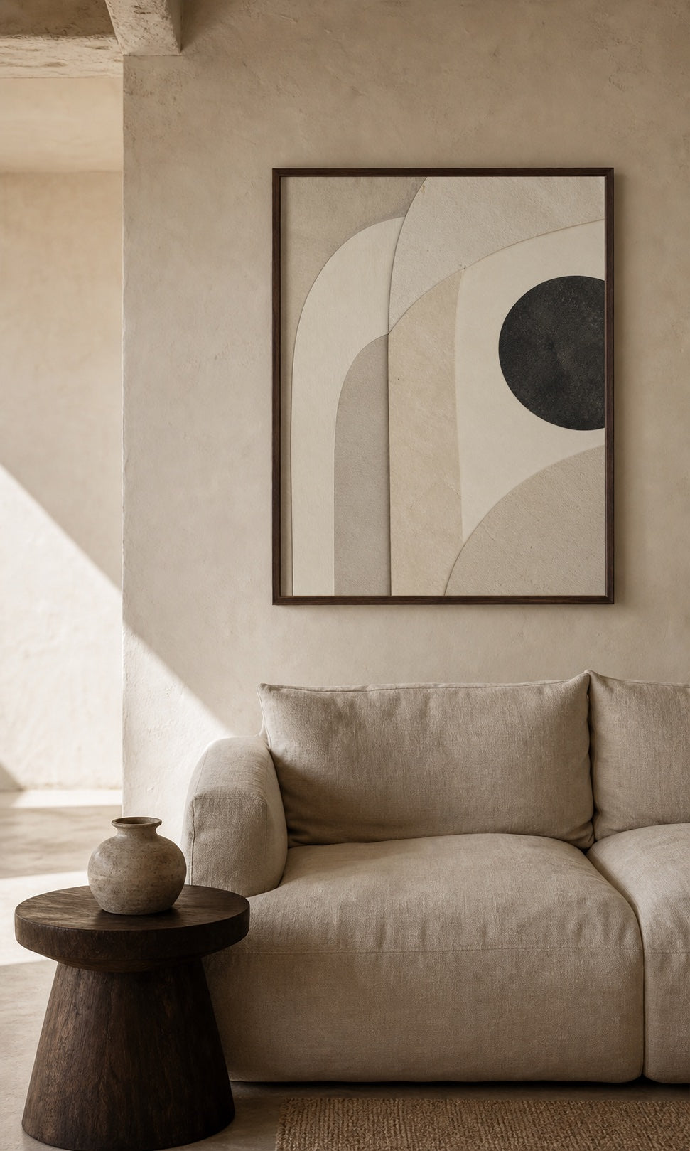 Quiet Form artwork in a walnut frame above an oat linen sofa